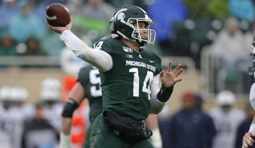 Michigan State quarterback Brian Lewerke throws a pass against Penn State during the second quarter of an NCAA college football game, Saturday, Oct. 26, 2019, in East Lansing, Mich. (AP Photo/Al Goldis)