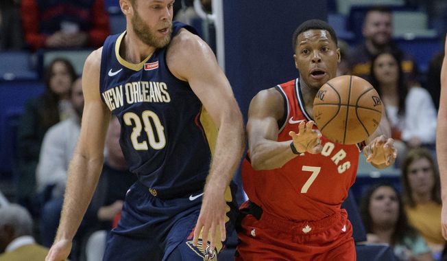 Toronto Raptors guard Kyle Lowry (7) passes the ball away from New Orleans Pelicans forward Nicolo Melli (20) during the first half of an NBA basketball game in New Orleans, Friday, Nov. 8, 2019. (AP Photo/Matthew Hinton)