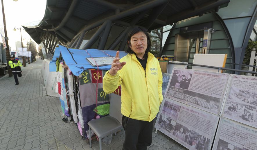 In this April 2, 2019, photo, Choi Seung-woo, a victim of Brothers Home, speaks during an interview in front of National Assembly in Seoul, South Korea. Choi and a small number of other Brothers Home inmates have been camping out in front of the National Assembly’s gate for more than two years calling for lawmakers to pass a bill that would launch a full investigation into past human rights atrocities, including the Brothers Home incident. Notorious South Korean facility that kidnapped, abused and enslaved children and the disabled for a generation was also shipping children overseas for adoption as part of a massive profit-seeking enterprise. (AP Photo/Ahn Young-joon)