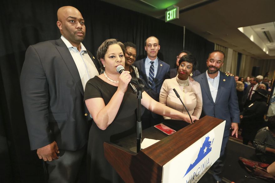 In this Tuesday, Nov. 5, 2019, photo, state State Sen. Jennifer McClellan, D-Richmond, front, speaks to supporters as she is joined by Del. Lamont Bagby, D-Henrico, left, and other members of the Legislative Black Caucus at a Democratic victory party in Richmond, Va. The caucus has made significant gains since the Blackface scandal and a black woman is in the mix for the new House speaker. (AP Photo/Steve Helber)