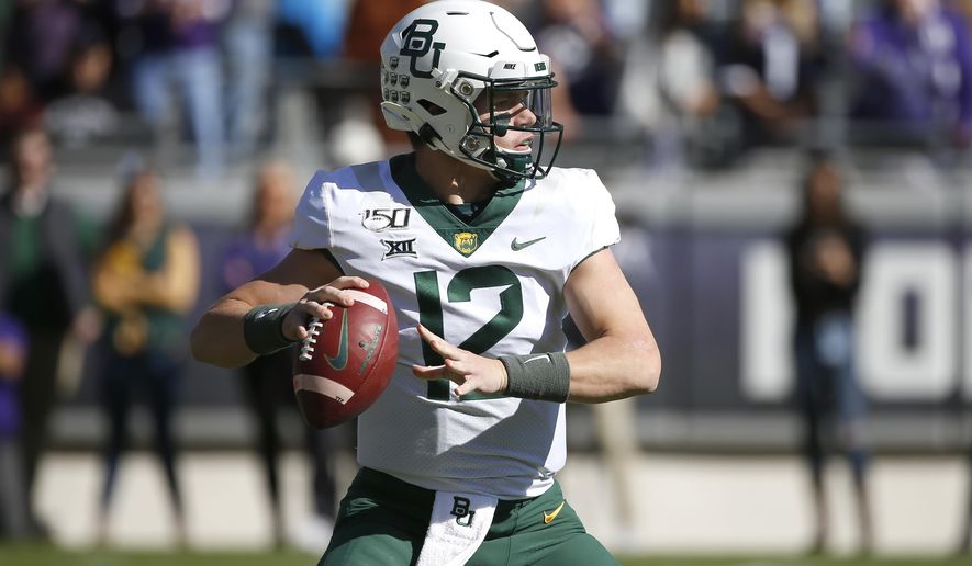 Baylor quarterback Charlie Brewer (12) looks to throw against TCU during the first half of an NCAA college football game, Saturday, Nov. 9, 2019, in Fort Worth, Texas. (AP Photo/Ron Jenkins)