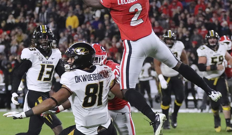 CORRECTS LOCATION TO ATHENS, INSTEAD OF ATLANTA - Georgia defensive back Richard LeCounte goes up to intercept a Missouri pass intended for tight end Albert Okwuegbunam during the second quarter of an NCAA college football game on Saturday, Nov. 9, 2019, in Athens, Ga. (Curtis Compton/Atlanta Journal-Constitution via AP)