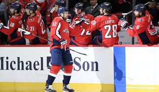 Washington Capitals center Evgeny Kuznetsov (92), of Russia, celebrates his goal during the first period of an NHL hockey game against the Vegas Golden Knights, Saturday, Nov. 9, 2019, in Washington. (AP Photo/Nick Wass)
