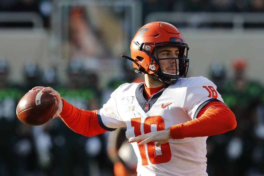 Illinois quarterback Brandon Peters throws during the first half of an NCAA college football game against Michigan State, Saturday, Nov. 9, 2019, in East Lansing, Mich. (AP Photo/Carlos Osorio)