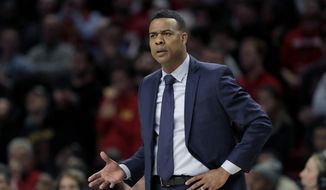 Rhode Island head coach David Cox talks to an official during the first half of an NCAA college basketball game against Maryland, Saturday, Nov. 9, 2019, in College Park, Md. (AP Photo/Julio Cortez) **FILE**
