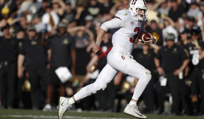 Stanford quarterback K.J. Costello runs for a short gain against Colorado in the second half of an NCAA college football game, Saturday, Nov. 9, 2019, in Boulder, Colo. Colorado won 16-13. (AP Photo/David Zalubowski)