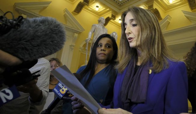 In this Feb. 21, 2019, file photo, Del. Charniele Herring, D-Alexandria, left, and House Minority Leader Eileen Filler-Corn, right, speak to the media at the rotunda inside the State Capitol in Richmond, Va. (Bob Brown/Richmond Times-Dispatch via AP, File)