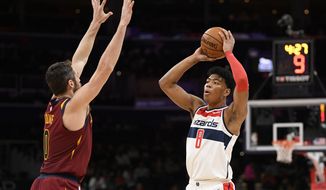 Washington Wizards forward Rui Hachimura (8), of Japan, holds the ball as Cleveland Cavaliers forward Kevin Love (0) defends during the first half of an NBA basketball game, Friday, Nov. 8, 2019, in Washington. (AP Photo/Nick Wass)