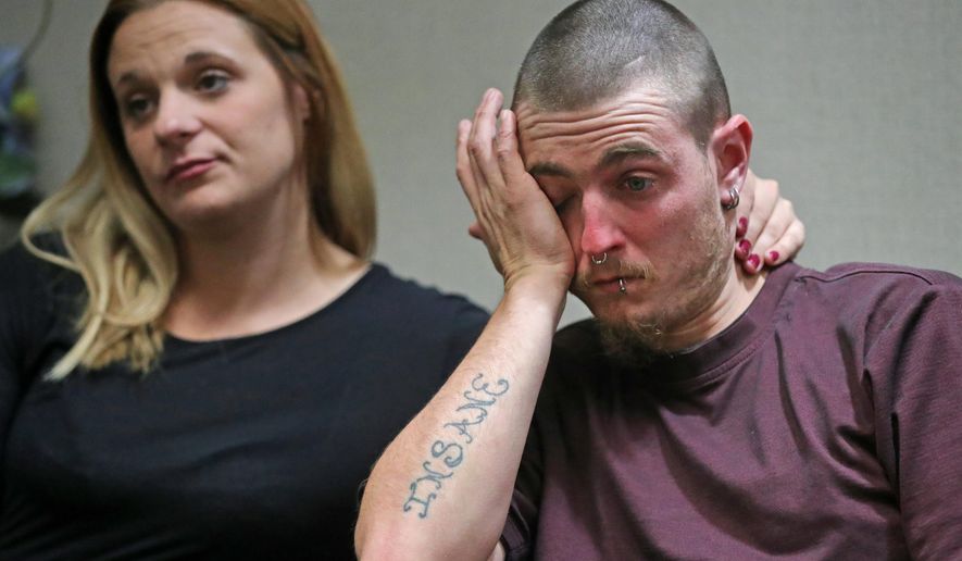 In this Tuesday, Oct. 15, 2019 photo, Danny Rowles wipes away tears in Akron, Ohio, after recalling the time he and his siblings were rescued from their home in 2003 after being abused by Alice Jenkins and her partner Mary Rowles. (Jeff Lange/Akron Beacon Journal via AP)
