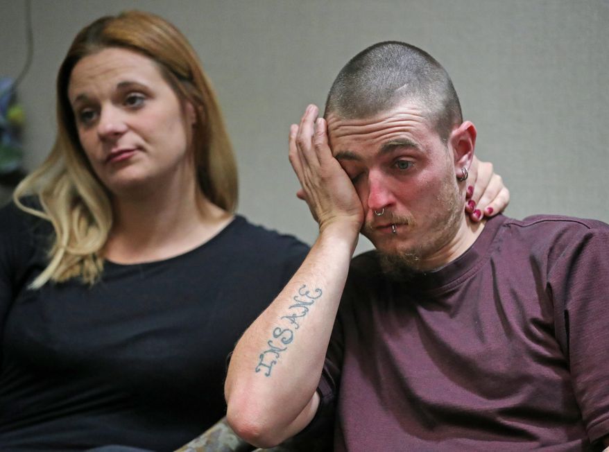 In this Tuesday, Oct. 15, 2019 photo, Danny Rowles wipes away tears in Akron, Ohio, after recalling the time he and his siblings were rescued from their home in 2003 after being abused by Alice Jenkins and her partner Mary Rowles. (Jeff Lange/Akron Beacon Journal via AP)