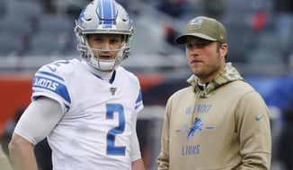 Detroit Lions quarterback&#39;s Jeff Driskel (2) and Matthew Stafford watch during warmups before an NFL football game against the Chicago Bears in Chicago, Sunday, Nov. 10, 2019. (AP Photo/Charles Rex Arbogast)