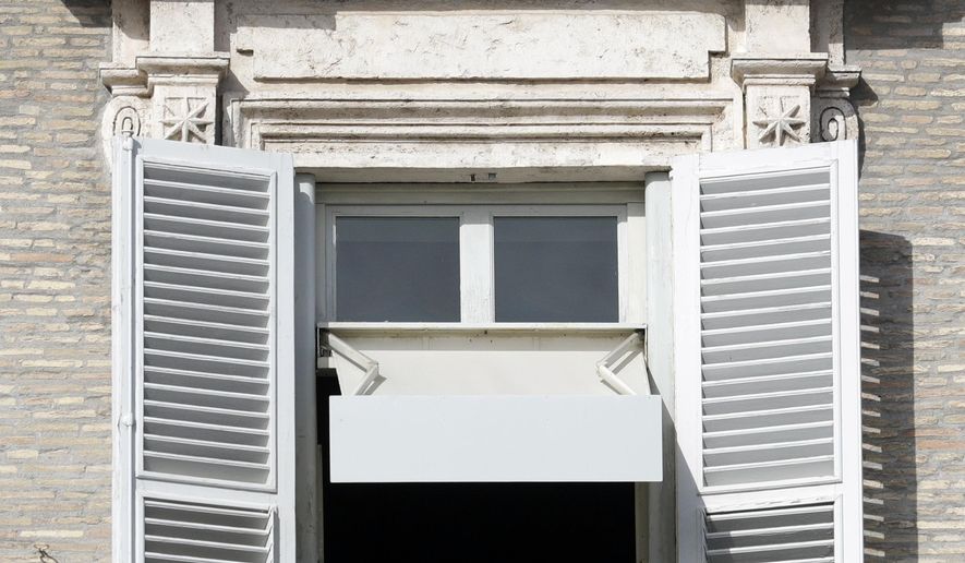 Pope Francis delivers his blessing during his Angelus prayer from his studio window overlooking St. Peter's Square, at the Vatican, Sunday, Nov. 10, 2019. (AP Photo/Gregorio Borgia)