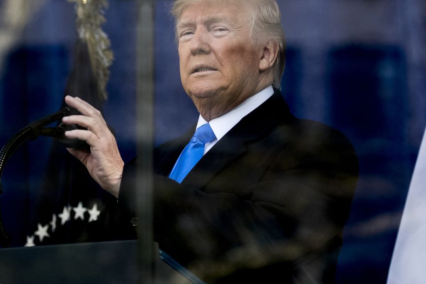 President Donald Trump arrives for a wreath laying ceremony at the New York City Veterans Day Parade at Madison Square Park, in Washington, Monday, Nov. 11, 2019. (AP Photo/Andrew Harnik)