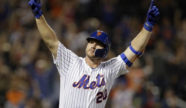 In this Sept. 28, 2019, file photo, New York Mets&#x27; Pete Alonso reacts after hitting a home run during the third inning of a baseball game against the Atlanta Braves, in New York. Mets first baseman Pete Alonso and Houston Astros slugger Yordan Álvarez have been picked as this year’s top rookies by Baseball Digest. (AP Photo/Adam Hunger, File) **FILE**