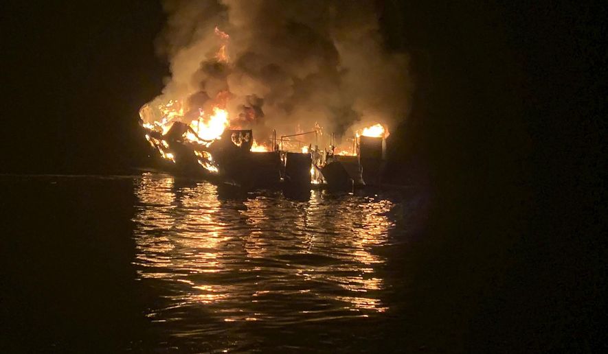 FILE - In this Sept. 2, 2019, file photo provided by the Santa Barbara County Fire Department, the dive boat Conception is engulfed in flames after a deadly fire broke out aboard the commercial scuba diving vessel off the Southern California Coast. The widow of Justin Dignam, one of the 34 people who died in the fire, has filed a lawsuit against the boat's owners, making it the first claim from one of the 34 victims' families. (Santa Barbara County Fire Department via AP, File)