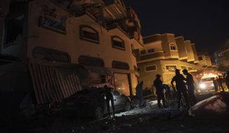 Palestinians check the damage of a house targeted by Israeli missile strikes in Gaza City, Tuesday, Nov. 12, 2019. The Israeli military says it has struck a Gaza City house, targeting a commander from the Islamic Jihad group in a resumption of pinpointed killing. The Iranian-backed Palestinian group confirmed Tuesday that Bahaa Abu el-Atta, it&#39;s north Gaza Strip commander, was killed. (AP Photo/Khalil Hamra)