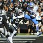 Detroit Lions wide receiver Marvin Jones Jr. (11) catches a touchdown pass against Oakland Raiders&#39; Daryl Worley (20) and Karl Joseph (42) during the first half of an NFL football game in Oakland, Calif., Sunday, Nov. 3, 2019. (AP Photo/John Hefti)