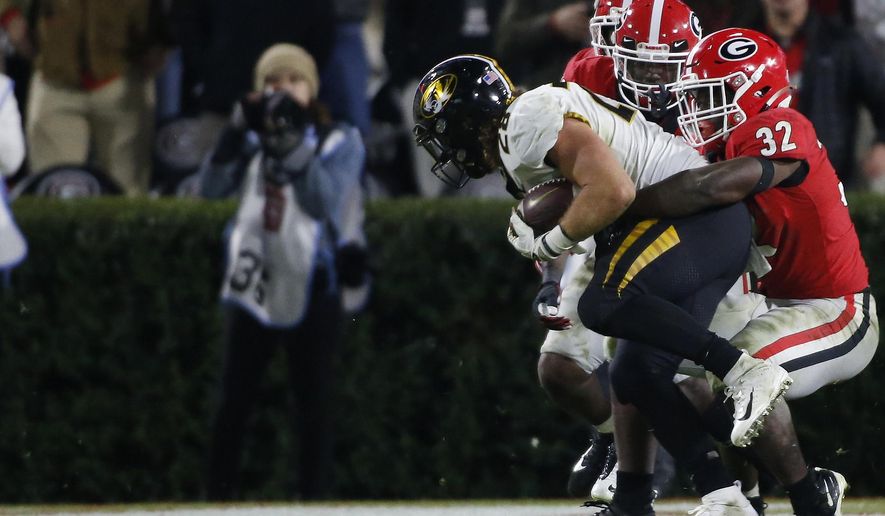 Georgia inside linebacker Monty Rice (32) stops Missouri running back Dawson Downing (28) at the goal line during the second half of an NCAA college football game Saturday, Nov. 9, 2019, in Athens, Ga. (Joshua L. Jones/Athens Banner-Herald via AP)