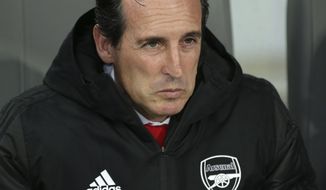 Arsenal&#39;s head coach Unai Emery sits on the bench during the Europa League group F soccer match between Vitoria SC and Arsenal at the D. Afonso Henriques stadium in Guimaraes, Portugal, Wednesday, Nov. 6, 2019. (AP Photo/Luis Vieira)