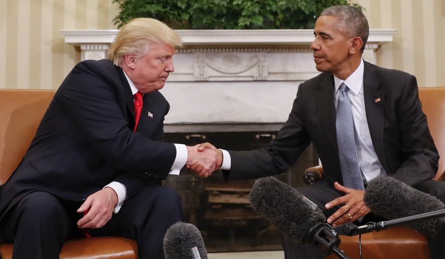President Barack Obama and President-elect Donald Trump shake hands following their meeting in the Oval Office of the White House in Washington, Thursday, Nov. 10, 2016. (AP Photo/Pablo Martinez Monsivais)