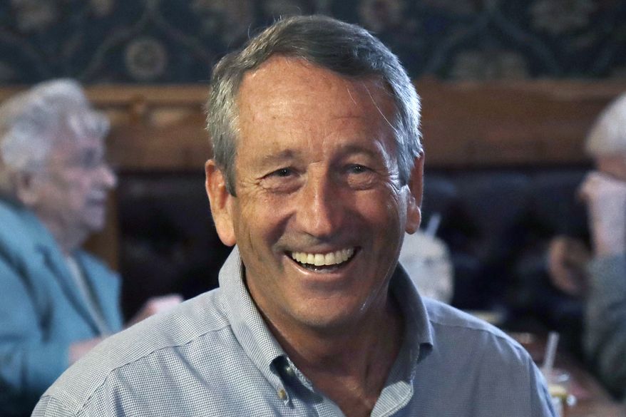 In this Sept. 19, 2019, file photo, Republican presidential candidate, former South Carolina Gov. Mark Sanford, smiles as he talks with customers at the Puritan Backroom restaurant, during a campaign stop in Manchester, N.H. (AP Photo/Elise Amendola)