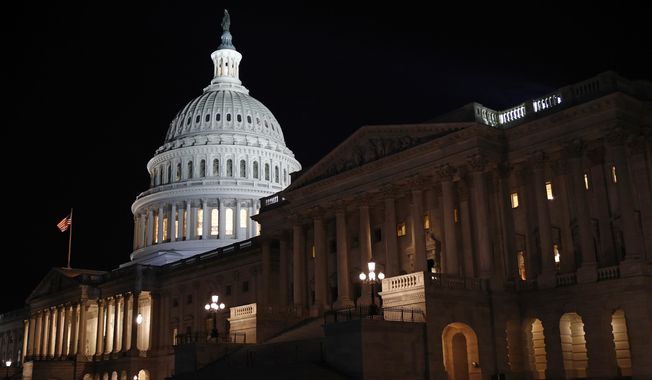 Floodlights illuminate the U.S. Capitol dome in Washington, late Tuesday, Nov. 12, 2019. (AP Photo/Patrick Semansky) **FILE**