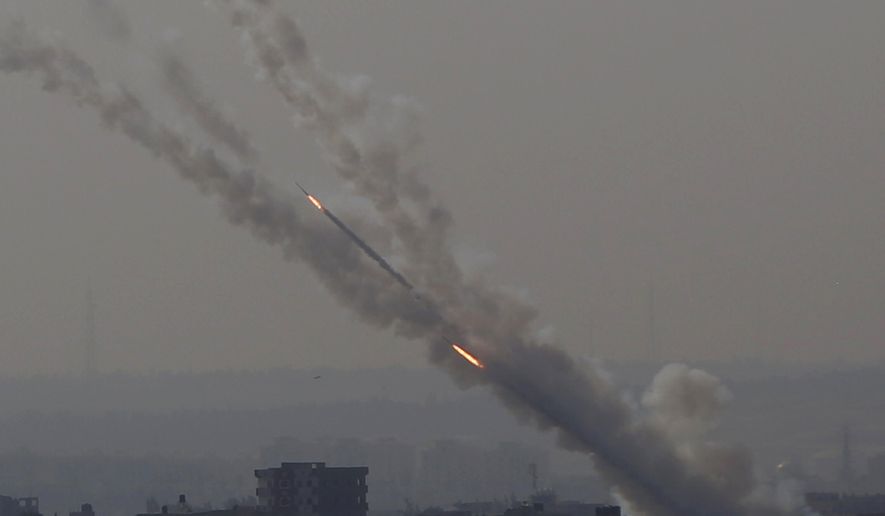 Rockets are launched from Gaza Strip to Israel, Tuesday, Nov. 12, 2019. Israel killed a senior Islamic Jihad commander in Gaza early Tuesday in a resumption of pinpointed targeting that threatens a fierce round of cross-border violence with Palestinian militants. (AP Photo/Hatem Moussa)