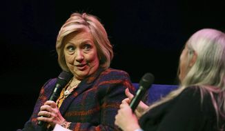 U.S. former Secretary of State Hillary Clinton, left, talks to Classicist Mary Beard, at the Southbank Centre in London during the launch of &quot;Gutsy Women: Favorite Stories of Courage and Resilience,&quot; a book by Chelsea and Hillary Clinton, in London, Sunday, Nov. 10, 2019. (Aaron Chown/PA via AP) ** FILE **