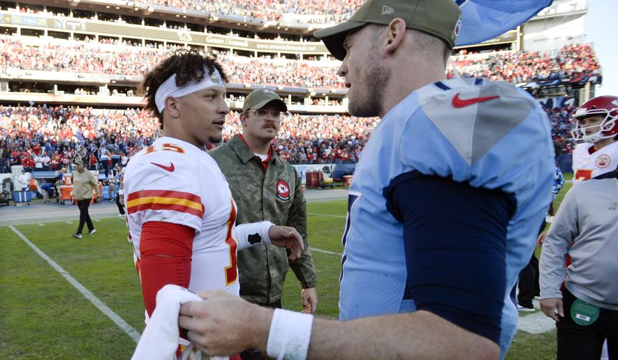 Kansas City Chiefs quarterback Patrick Mahomes (15) congratulates Tennessee Titans quarterback Ryan Tannehill (17) after an NFL football game Sunday, Nov. 10, 2019, in Nashville, Tenn. The Titans won 35-32. (AP Photo/Mark Zaleski)