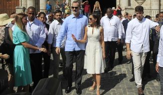 Spain&#39;s King Felipe VI and Queen Letizia walk in Old Havana, Cuba, Tuesday, Nov. 12, 2019. (Jorge Luis Baños/Pool Photo via AP)