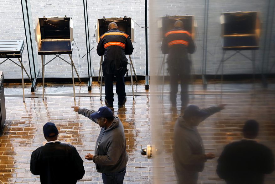 FILE - In this Nov. 5, 2019, file photo, voters cast their ballots at Hampton City Hall, in Hampton, Va. As election results came in last week from Kentucky and Virginia, social media posts offered an unsubstantiated explanation for Republican losses: voter fraud. The responses offer a glimpse into the type of misinformation that could cloud next year’s presidential race. (Jonathon Gruenke/The Virginian-Pilot via AP, File)