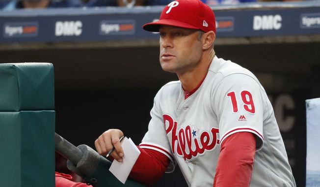 FILE - In this July 23, 2019, file photo, Philadelphia Phillies manager Gabe Kapler watches the team play the Detroit Tigers in the first inning of a baseball game in Detroit. Kapler is new manager of the San Francisco Giants, replacing Bruce Bochy, who retired when the season ended. The Giants made the announcement late Tuesday, Nov. 12, and planned a formal introduction to follow. The 44-year-old Kapler was fired Oct. 10 after two seasons in Philadelphia and a 161-163 record. (AP Photo/Paul Sancya, File)
