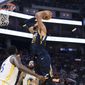 Utah Jazz center Rudy Gobert (27) shoots against the Golden State Warriors in the second half of an NBA basketball game in San Francisco, Monday, Nov. 11, 2019. The Jazz won 122-108. (AP Photo/John Hefti)