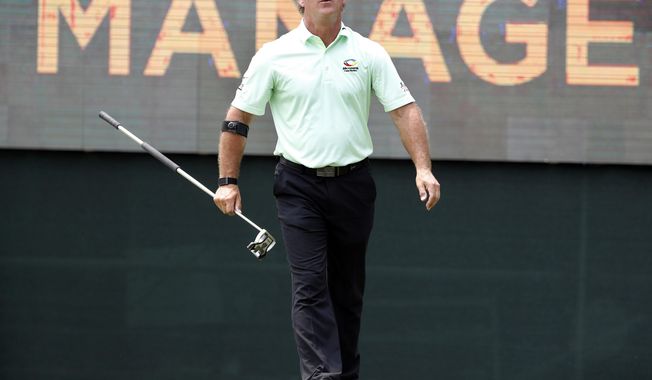 FILE - In this May 31, 2019 file photo Scott McCarron reacts after missing a putt on the 17th green during the first round of the PGA Tour Champions Principal Charity Classic golf tournament in Des Moines, Iowa. McCarron won the Charles Schwab Cup on Sunday, Nov. 10, 2019 in Phoenix while waiting in the clubhouse. (AP Photo/Charlie Neibergall)