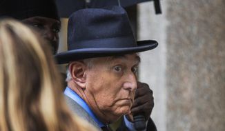 Roger Stone, a longtime Republican provocateur and former confidant of President Donald Trump, waits in line at the federal court in Washington, Tuesday, Nov. 12, 2019. (AP Photo/Manuel Balce Ceneta)