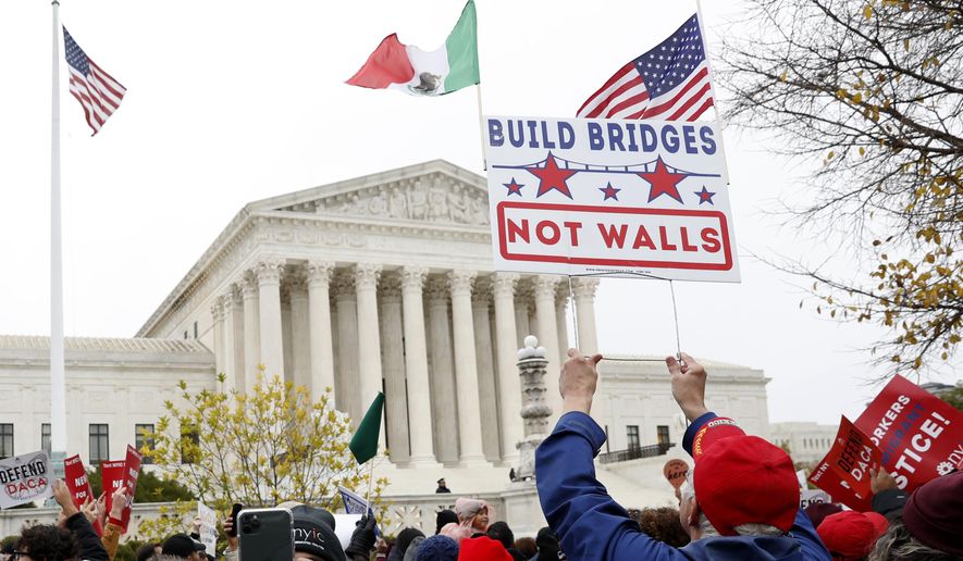 People rally outside the Supreme Court as oral arguments are heard in the case of President Trump&#39;s decision to end the Obama-era, Deferred Action for Childhood Arrivals program (DACA), Tuesday, Nov. 12, 2019, at the Supreme Court in Washington. (AP Photo/Jacquelyn Martin)