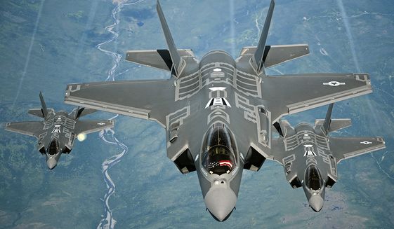 F-35A Lightning II aircraft receive fuel from a KC-10 Extender from Travis Air Force Base, Calif., July 13, 2015, during a flight from England to the U.S. The fighters were returning to Luke AFB, Ariz., after participating in the world's largest air show, the Royal International Air Tattoo. (U.S. Air Force photo/Staff Sgt. Madelyn Brown)