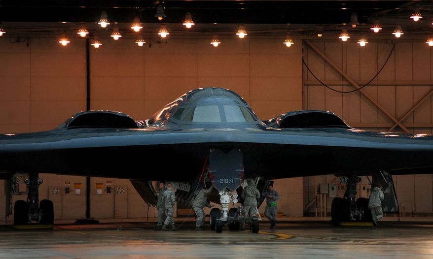 509th Aircraft Maintenance Squadron, maintainers and crew chiefs, prepare B-2 Stealth Bombers for Operation Odyssey Dawn March 19, 2011. (U.S. Air Force photo by Senior Airman Kenny Holston)(Released)