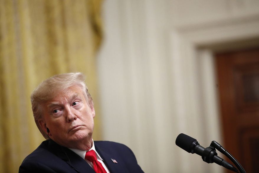 President Donald Trump listens during a news conference with Turkish President Recep Tayyip Erdogan in the East Room of the White House, Wednesday, Nov. 13, 2019, in Washington. (AP Photo/Patrick Semansky)