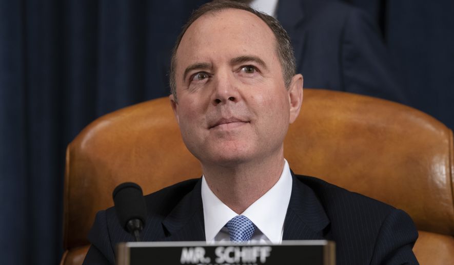 House Intelligence Committee Chairman Adam Schiff, D-Calif., listens as his panel hears testimony from top U.S. diplomat in Ukraine William Taylor and career Foreign Service officer George Kent, on Capitol Hill in Washington, Wednesday, Nov. 13, 2019, during the first public impeachment hearings of President Trump's efforts to tie U.S. aid for Ukraine to investigations of his political opponents. (AP Photo/J. Scott Applewhite)