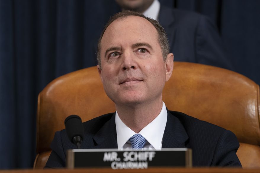 House Intelligence Committee Chairman Adam Schiff, D-Calif., listens as his panel hears testimony from top U.S. diplomat in Ukraine William Taylor and career Foreign Service officer George Kent, on Capitol Hill in Washington, Wednesday, Nov. 13, 2019, during the first public impeachment hearings of President Trump's efforts to tie U.S. aid for Ukraine to investigations of his political opponents. (AP Photo/J. Scott Applewhite)