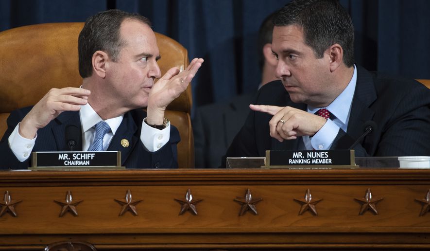 House Intelligence Committee Chairman Rep. Adam Schiff, D-Calif., left, talks with ranking member Rep. Devin Nunes, R-Calif., during a hearing of the House Intelligence Committee on Capitol Hill in Washington, Wednesday, Nov. 13, 2019, during the first public impeachment hearing of President Donald Trump&#39;s efforts to tie U.S. aid for Ukraine to investigations of his political opponents. (Saul Loeb/Pool Photo via AP)