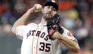 FILE - In this July 24, 2019, file photo, Houston Astros starting pitcher Justin Verlander throws to an Oakland Athletics batter during a baseball game in Houston. Verlander has been awarded his second AL Cy Young Award. (AP Photo/Michael Wyke) ** FILE **