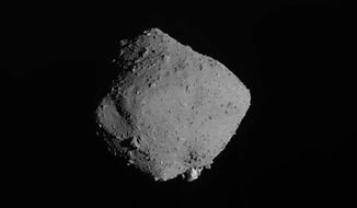 This image released on Wednesday, Nov. 13, 2019, by the Japan Aerospace Exploration Agency (JAXA), shows asteroid Ryugu taken by Japan’s Hayabusa2 spacecraft. The Japan spacecraft has departed from the distant asteroid, starting its yearlong journey home after successfully completing its mission to bring back soil samples and data that could provide clues to the origins of the solar system. (JAXA via AP)