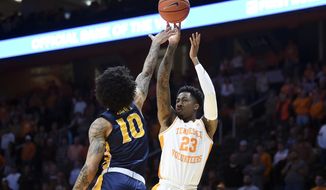 Tennessee guard Jordan Bowden (23) shoots as Murray State guard Tevin Brown (10) defends during an NCAA college basketball game Tuesday, Nov. 12, 2019, in Knoxville, Tenn. (Saul Young/Knoxville News Sentinel via AP)