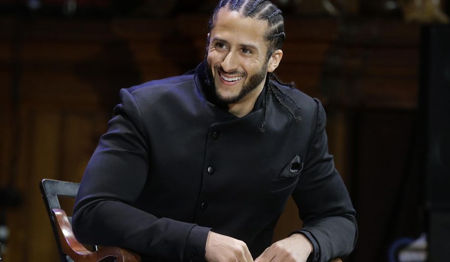 In this Oct. 11, 2018, file photo, former NFL football quarterback Colin Kaepernick smiles on stage during W.E.B. Du Bois Medal ceremonies at Harvard University, in Cambridge, Mass. Kaepernick plans to audition for NFL teams on Saturday, Nov. 16, 2019, in a private workout arranged by the league to be held in Atlanta. (AP Photo/Steven Senne, File) **FILE**