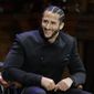 In this Oct. 11, 2018, file photo, former NFL football quarterback Colin Kaepernick smiles on stage during W.E.B. Du Bois Medal ceremonies at Harvard University, in Cambridge, Mass. Kaepernick plans to audition for NFL teams on Saturday, Nov. 16, 2019, in a private workout arranged by the league to be held in Atlanta. (AP Photo/Steven Senne, File) **FILE**