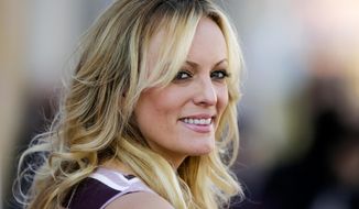 In this Oct. 11, 2018, file photo, adult film actress Stormy Daniels attends the opening of the adult entertainment fair &amp;quot;Venus,&amp;quot; in Berlin. (AP Photo/Markus Schreiber, File)