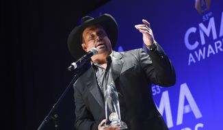 Singer-songwriter Garth Brooks speaks in the press room after winning the entertainer of the year award at the 53rd annual CMA Awards at Bridgestone Arena on Wednesday, Nov. 13, 2019, in Nashville, Tenn. (Photo by Evan Agostini/Invision/AP)