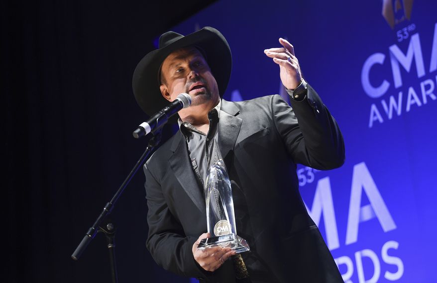 Singer-songwriter Garth Brooks speaks in the press room after winning the entertainer of the year award at the 53rd annual CMA Awards at Bridgestone Arena on Wednesday, Nov. 13, 2019, in Nashville, Tenn. (Photo by Evan Agostini/Invision/AP)